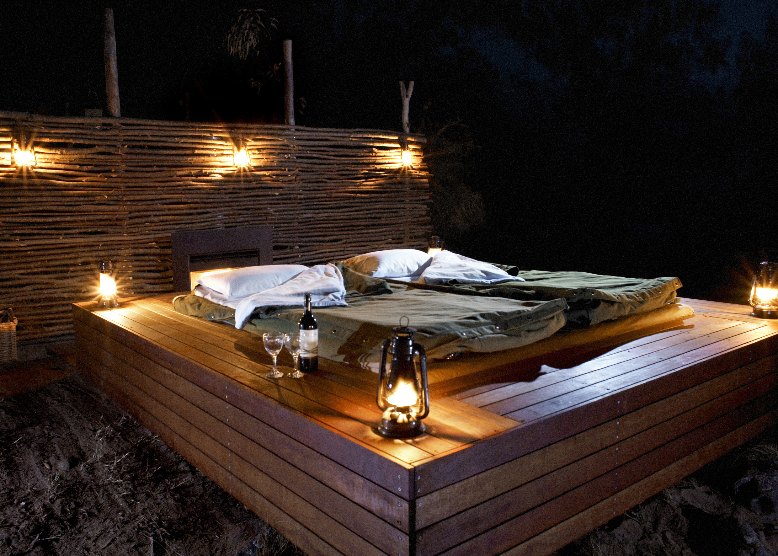 Sleep on the outdoor deck in a private deluxe safaris swag.